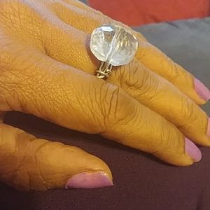 A large crystal ring with silver wire setting